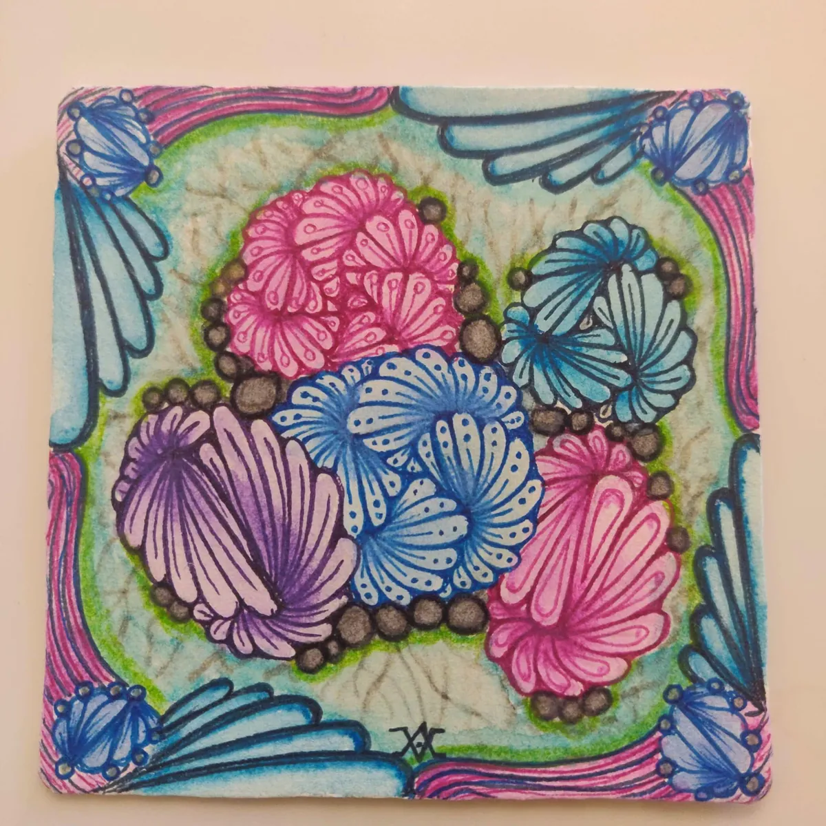 Colourful Zentangle tile with pink and blue shell tangles