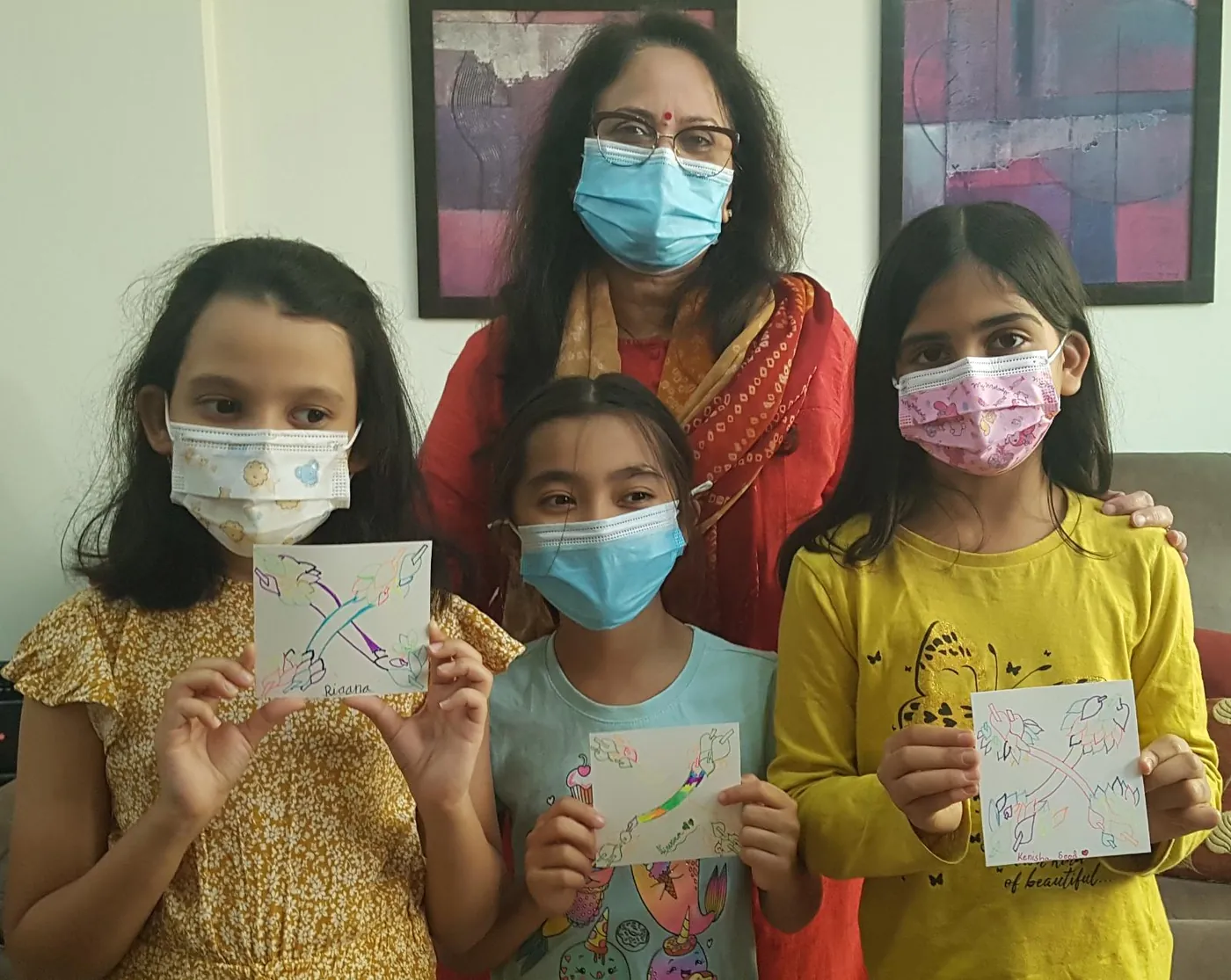 Rashim with young participants holding up their Zentangle tiles